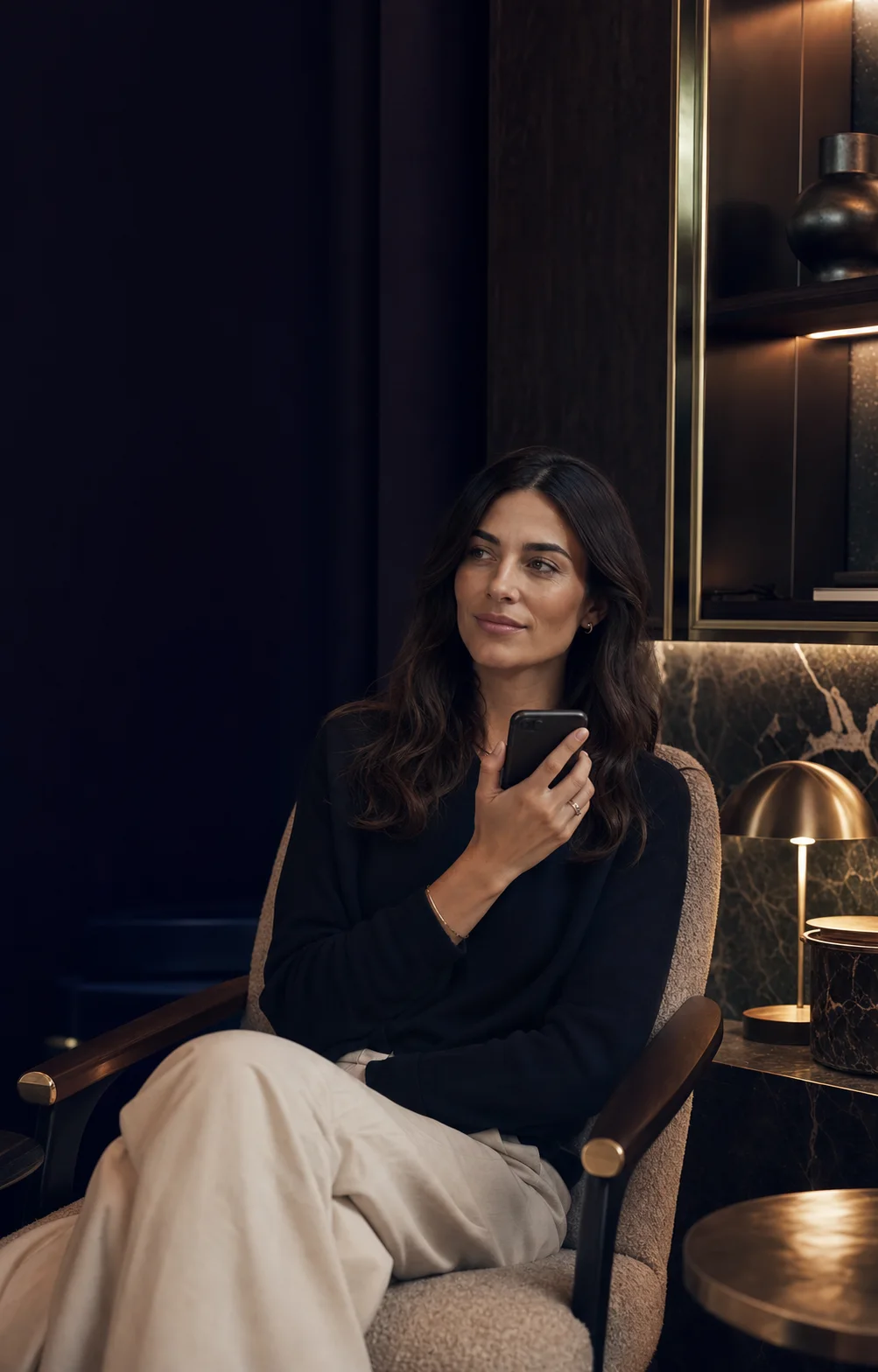 A woman recording a thoughtful voice introduction in a refined lounge